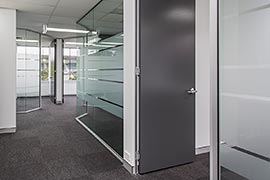 Glass office walls with frosted privacy stripes